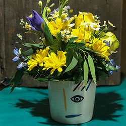 flower-arrangement-with-eye-on-pot-vase